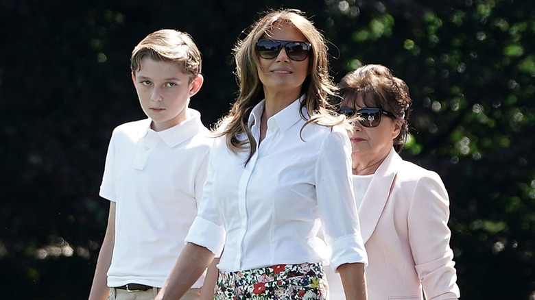 Barron, Melania Trump, and Amalija Knavs walking