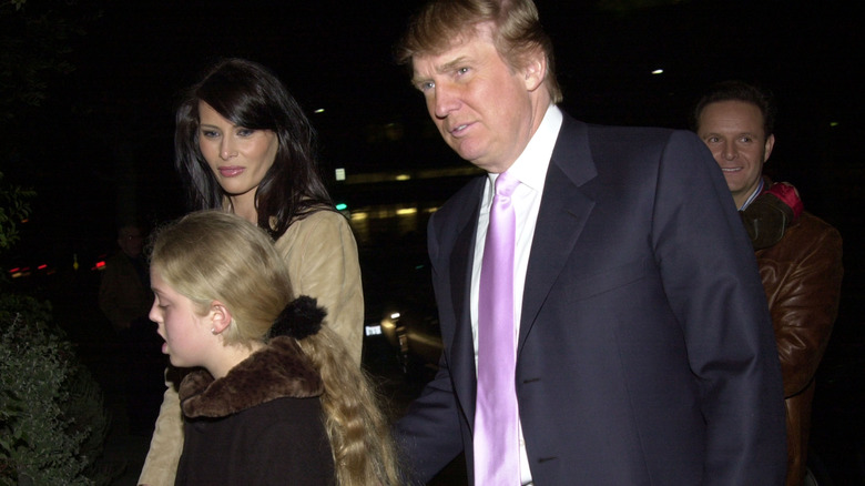 Melania Trump, Tiffany Trump, and Donald Trump walk together in the early 2000s