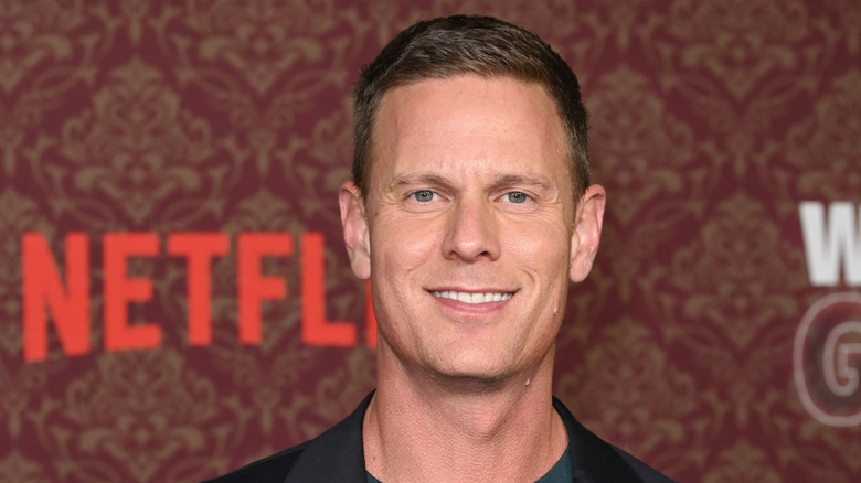 Christopher Landon smiling at a press event for Netflix