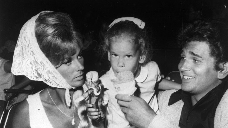 Michael Landon and his wife holding their daughter