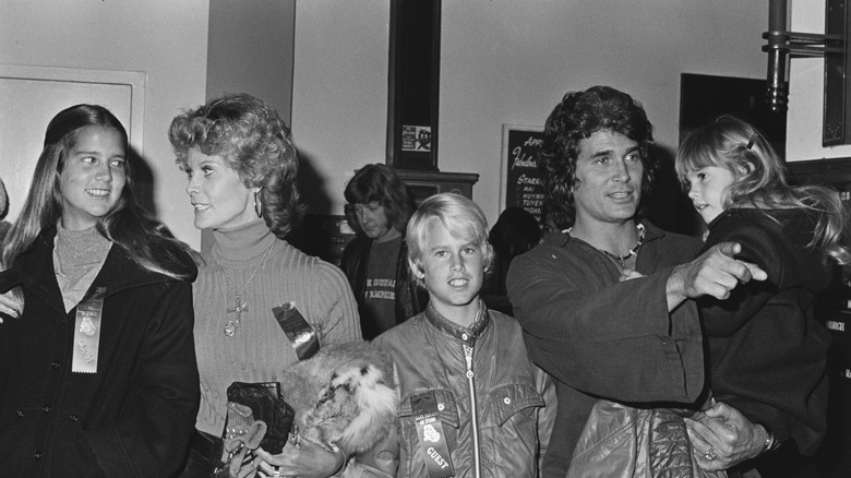 Michael Landon and his family smiling at a gathering