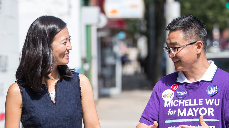 Michelle Wu speaking to a campaign worker