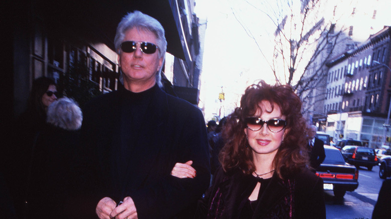 Larry Strickland and Naomi Judd walking