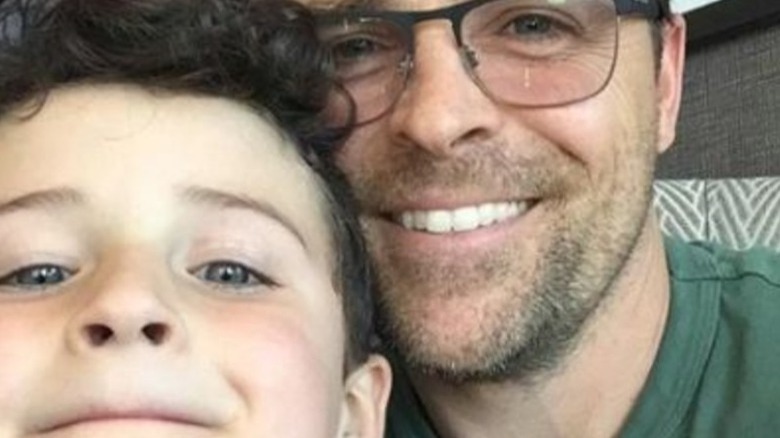 Kavan smith smiles with son 