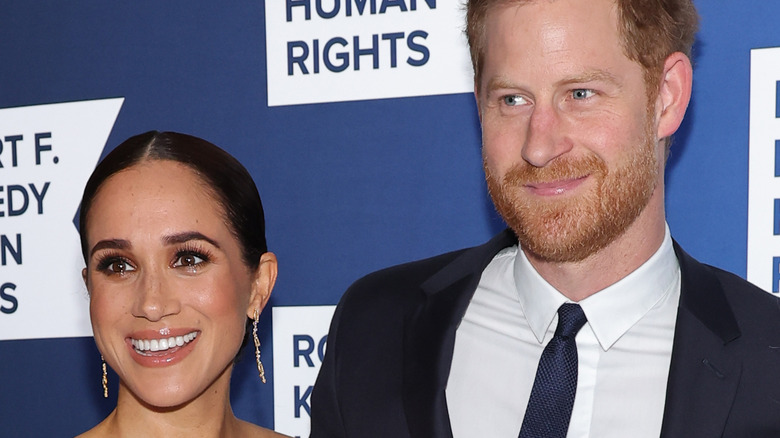 Prince Harry and Meghan Markle smiling