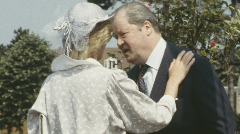 Diana hugs her father