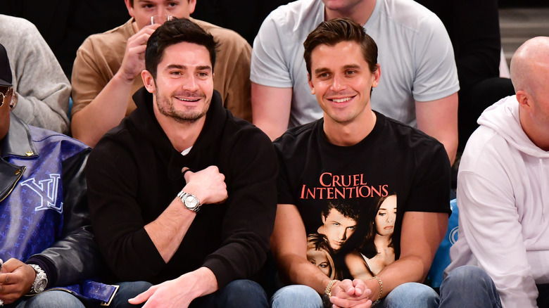 Kevin Harrington Antoni Porowski sitting courtside 