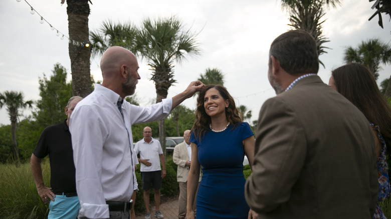 Patrick Bryant adjusts Nancy Mace's hair