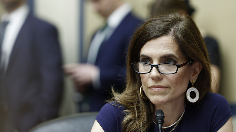 Nancy Mace wears glasses during a meeting