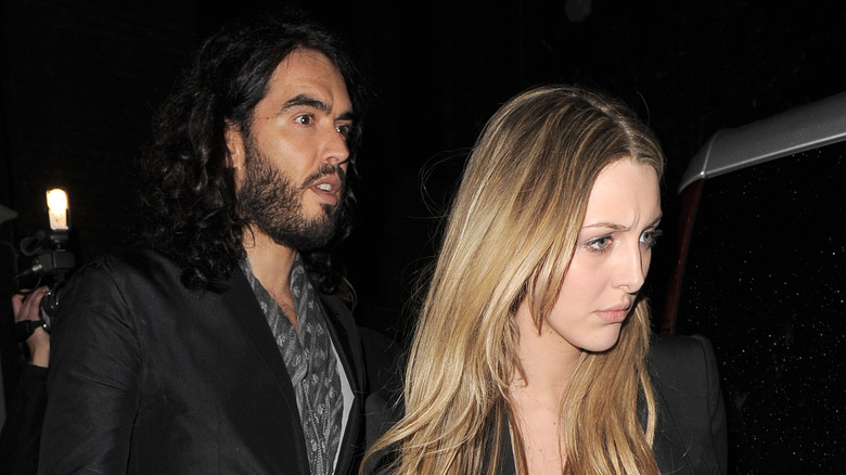 Russell Brand and his wife Laura getting into a car