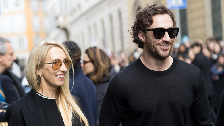 Sam and Aaron Taylor-Johnson walking