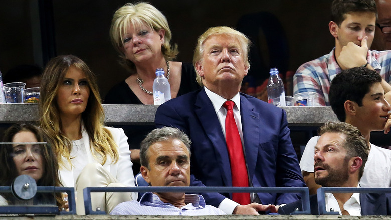 Donald and Melania Trump sitting in Wimbledon stands