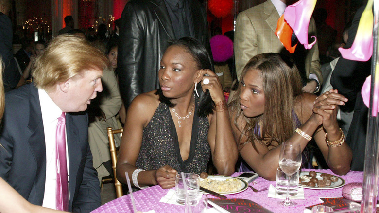 Donald Trump talking to Venus and Serena Williams