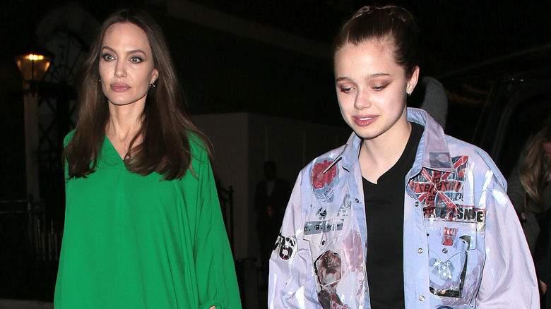 Angelina Jolie and Shiloh Jolie-Pitt walking at night