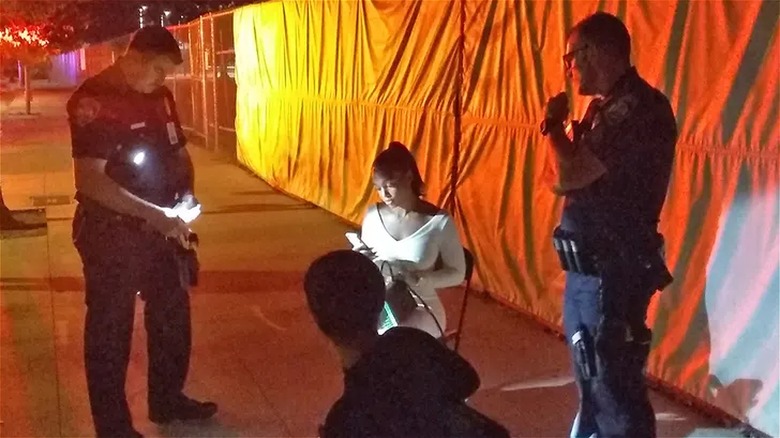 lori harvey sitting with police officers