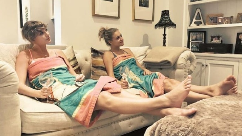 Taylor Swift and Kelsea Ballerini relax on sofa