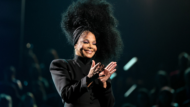 Janet Jackson smiling on stage