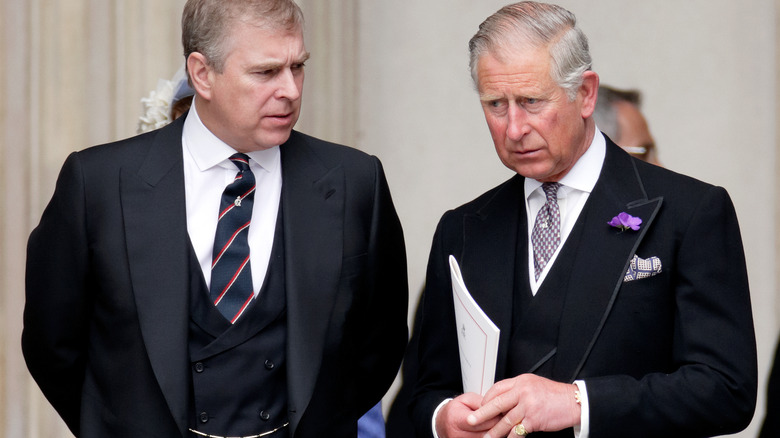 Prince Charles and Prince Andrew intently talking