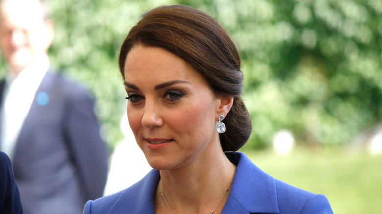 Kate Middleton smirking walking outside