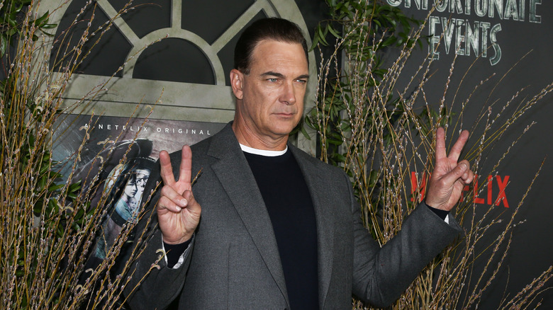 Patrick Warburton posing at a premiere