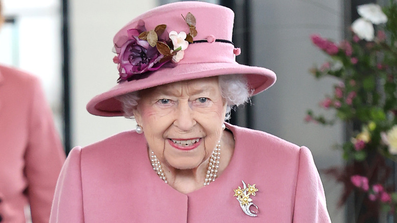 Queen in a Pink suit in Wales