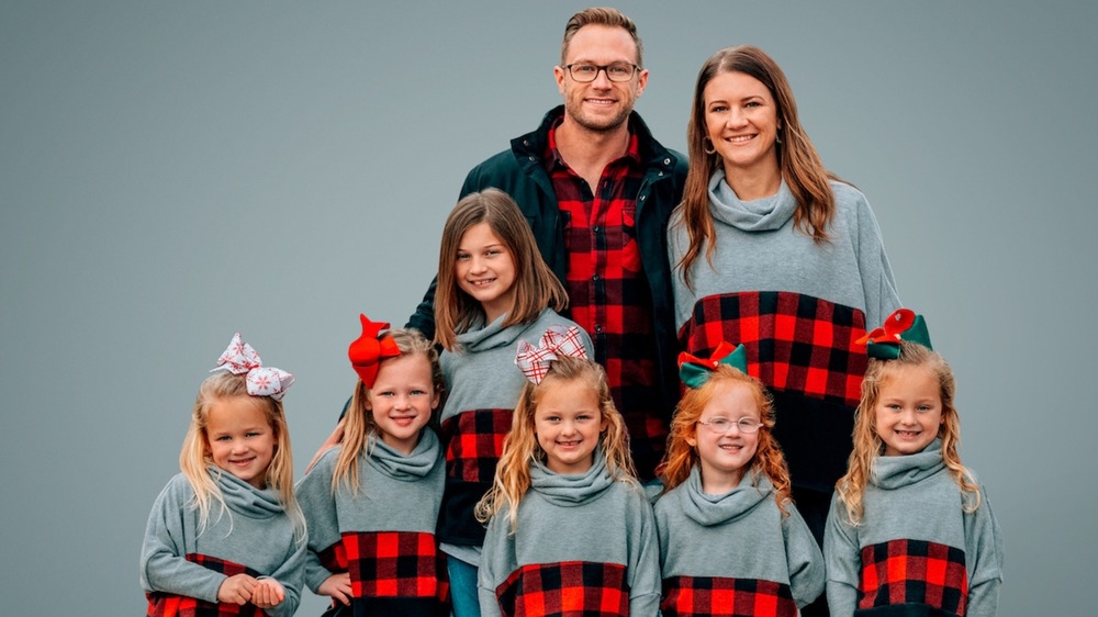 The Busby family from TLC's OutDaughtered posing for a portrait 