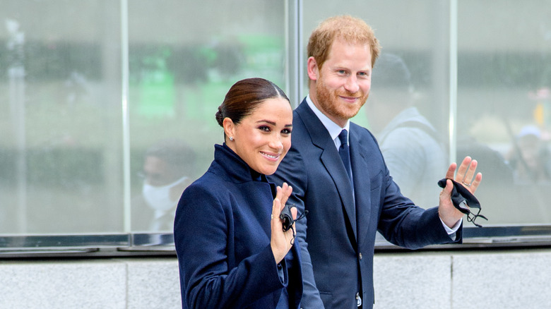 Meghan Markle and Prince Harry waving