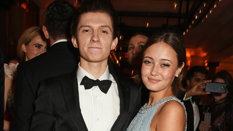 Tom Holland and Ella Purnell at an event