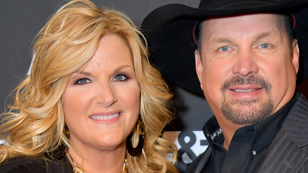 Trisha Yearwood and Garth Brooks smile together