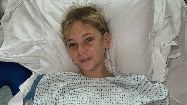 Lily Brooks O'Briant in a hospital bed