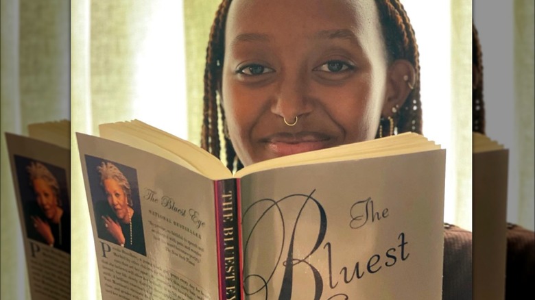 Zahara Jolie-Pitt holding a book