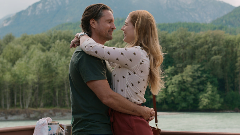 Martin Henderson hugs Alexandra Breckenridge.