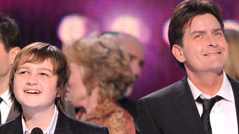 Angus T. Jones and Charlie Sheen on stage 