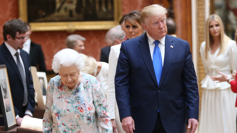 Donald Trump and Queen Elizabeth II walking together