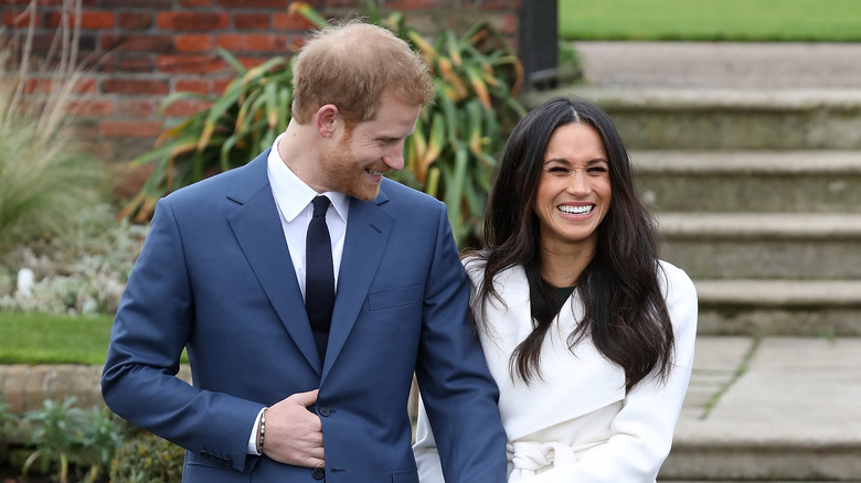 Prince Harry laughing with Meghan Markle