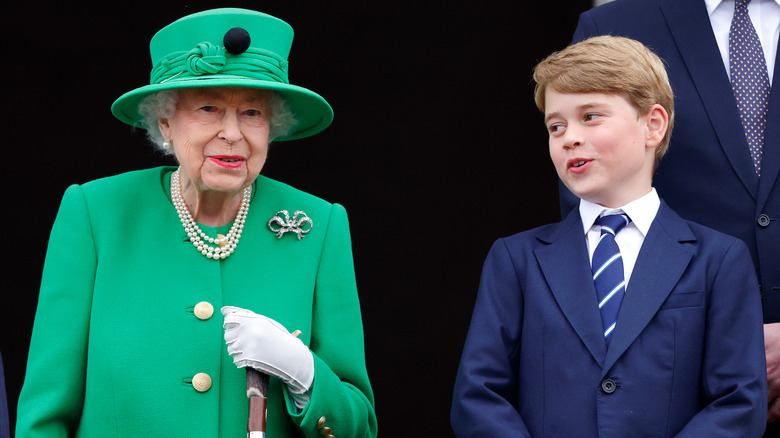 Queen Elizabeth and Prince George on balcony