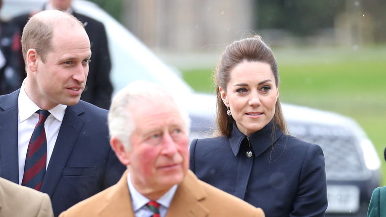 The Duke and Duchess of Cambridge and Prince Charles outside