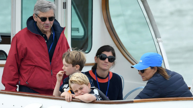 Carole and Michael Middleton on boat with Prince George