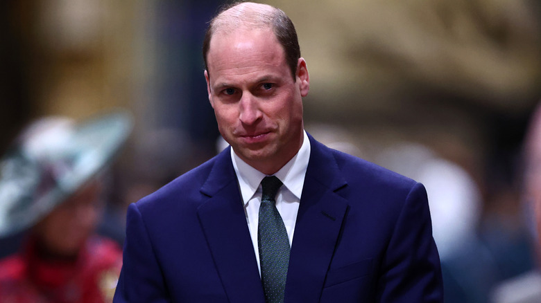 Prince William looking focused in a suit 