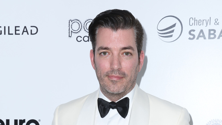 Jonathan Scott in a white tux