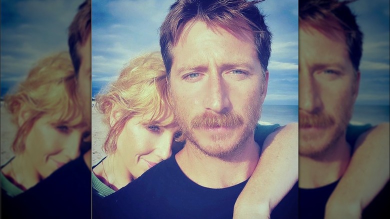 Kelly Reilly posing with husband