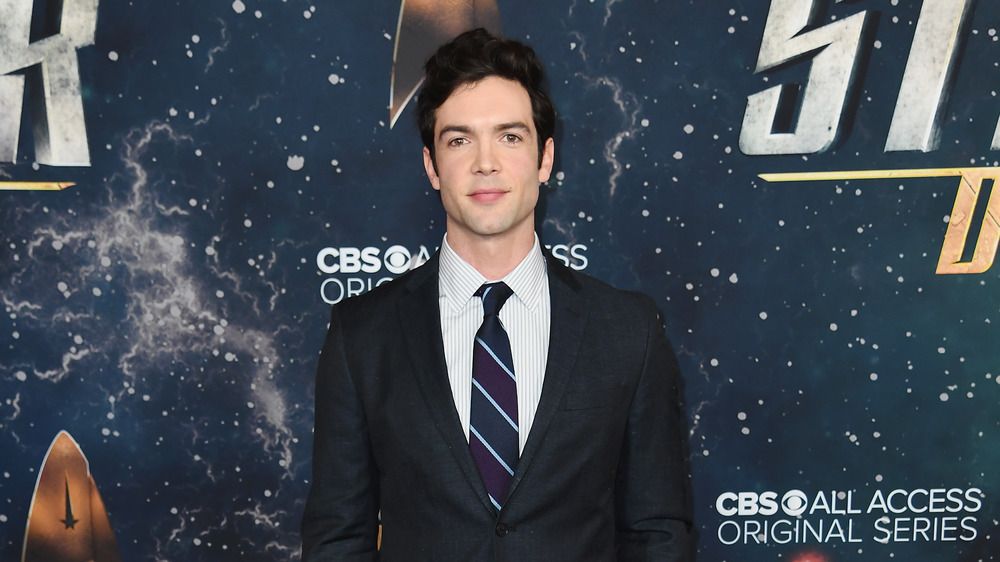 Ethan Peck in suit on red carpet