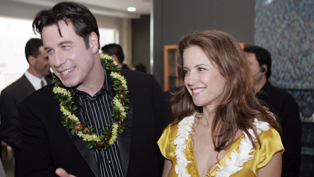 Preston and Travolta wearing leis in Hawaii