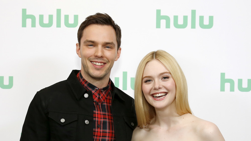 Nicholas Hoult and Elle Fanning smiling