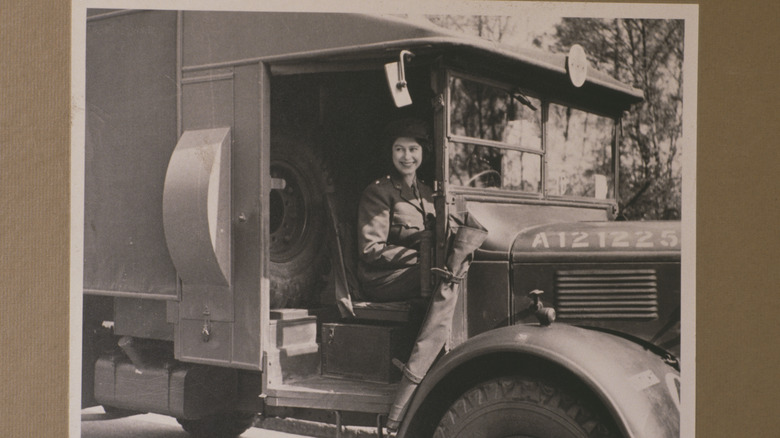 Queen  Elizabeth sitting in ambulance. 