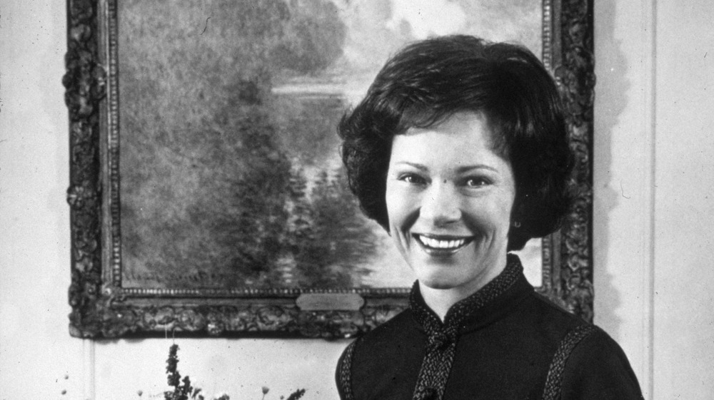 Rosalynn Carter smiles in a black and white photo