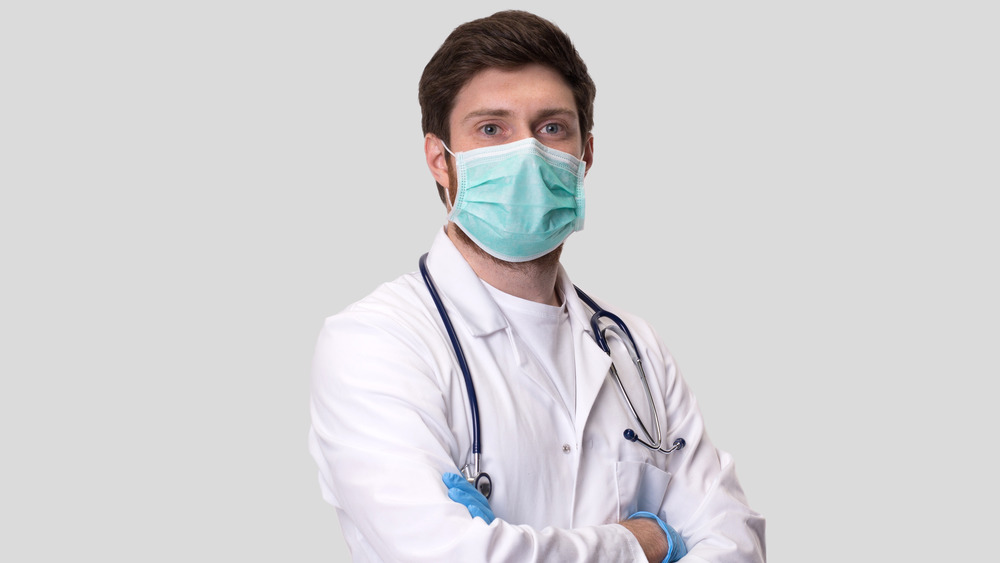 Doctor in white coat mask