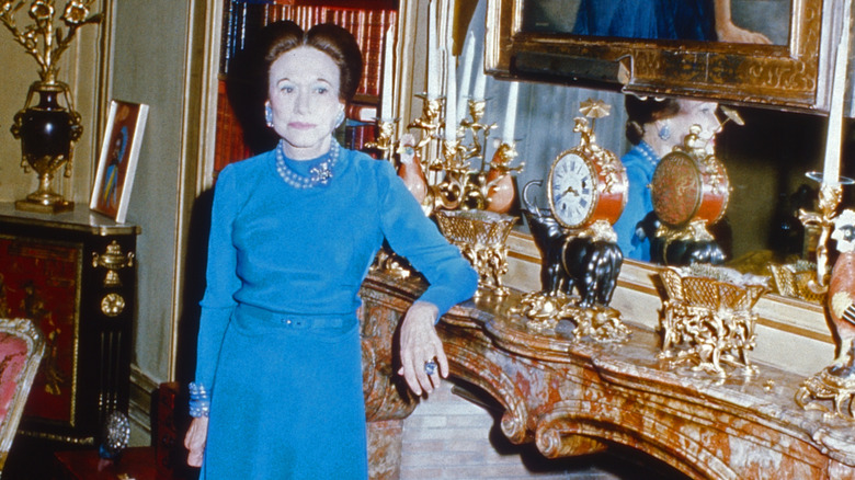 Wallis Simpson posing in front of her mantel