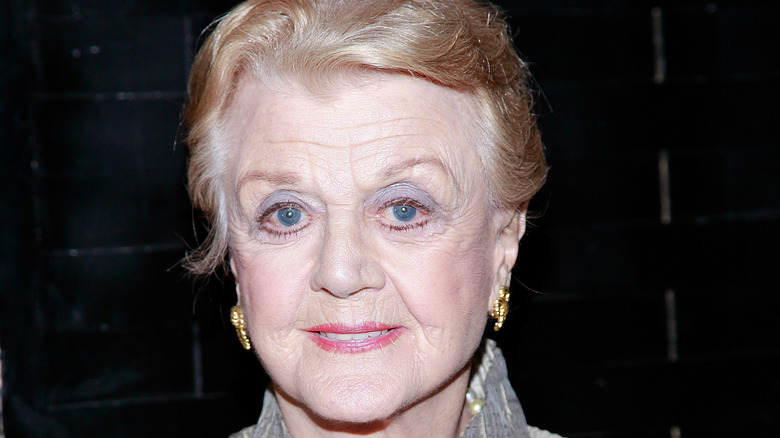 Angela Lansbury against a blue backdrop