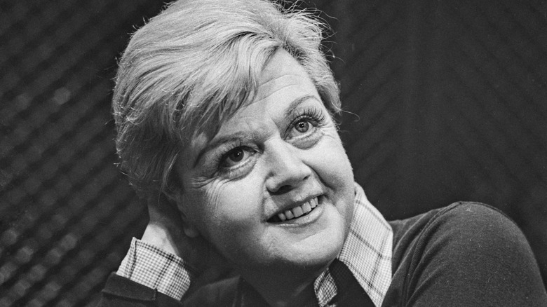 Angela Lansbury with head in hand